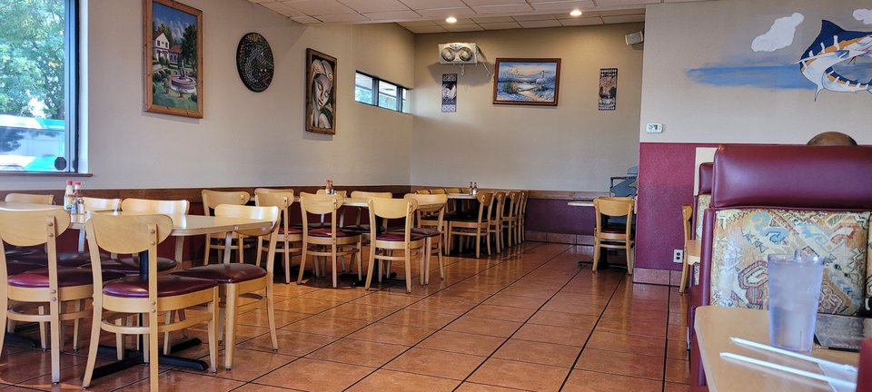 A busy lunch buffet with shared serving trays.
